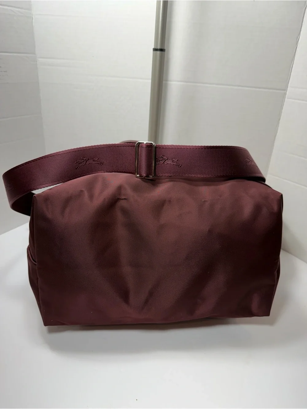 LONGCHAMP Burgundy medium Le Pliage tote from LONGCHAMP featuring leather trim